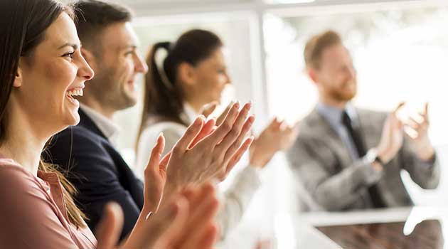 group of corporate partners clapping