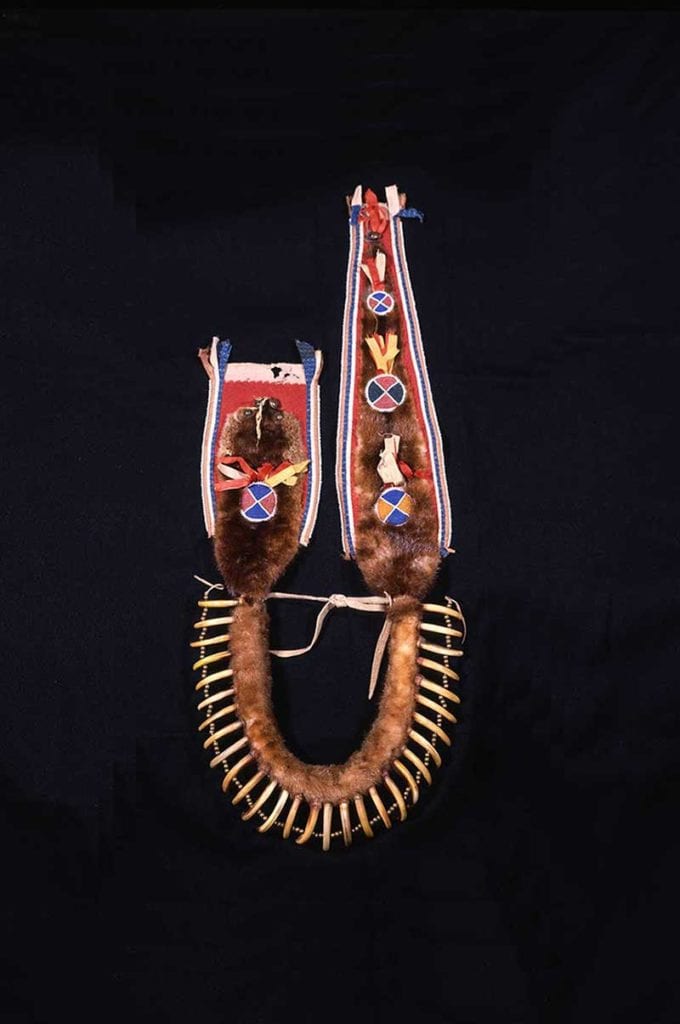 Unknown Pawnee artist, Bear Claw Necklace, ca. 1870, Grizzly bear claws, otter fur, silk ribbon, glass beads, brass beads, leather, cotton, wool, dyes, brass bells, pigments, cotton thread, Gift: Courtesy of Harrison Eiteljorg