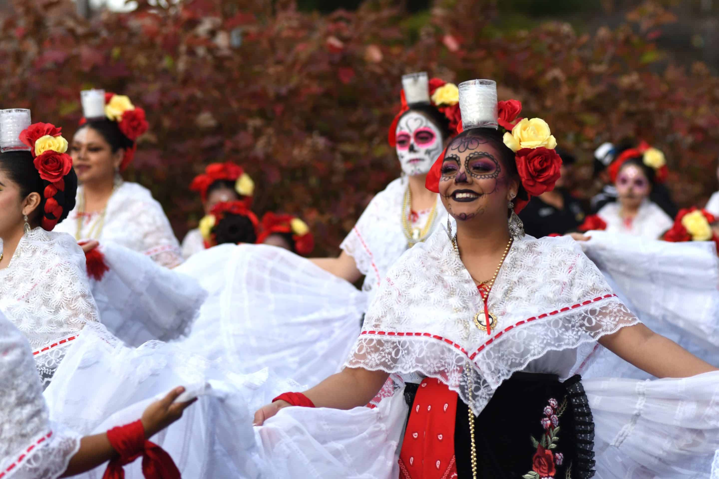 Dancers with Catrina makeup at a Día de los Muertos celebration