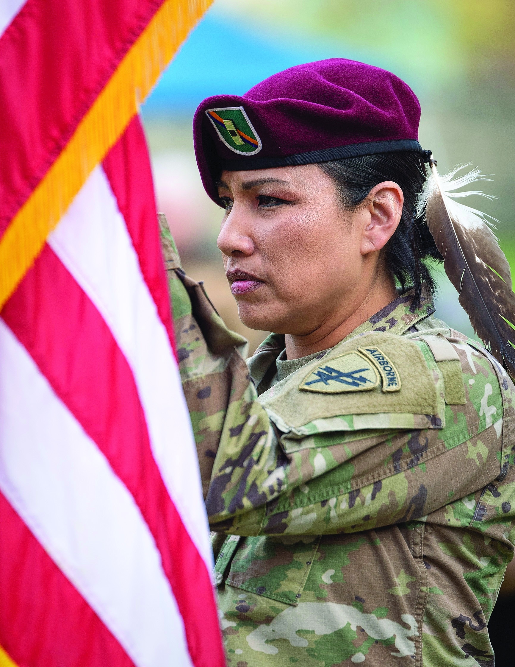 Flag bearer Misty “IglágTȟokáheWiŋ” Lakota (Oglala Lakota) leads Grand Entry at the 2018Georgetown University Powwow in Washington, DC. Teko Photography